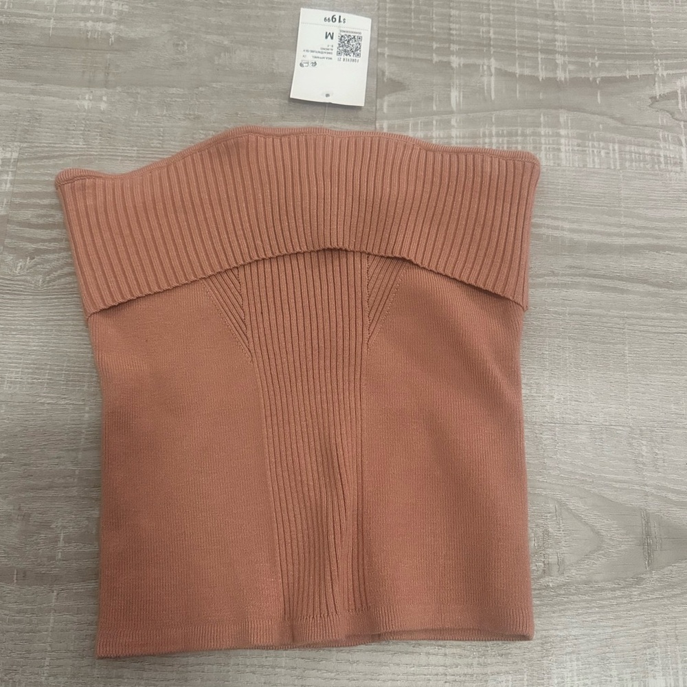 Women's Ribbed Sweater in orangey pink. Size medium